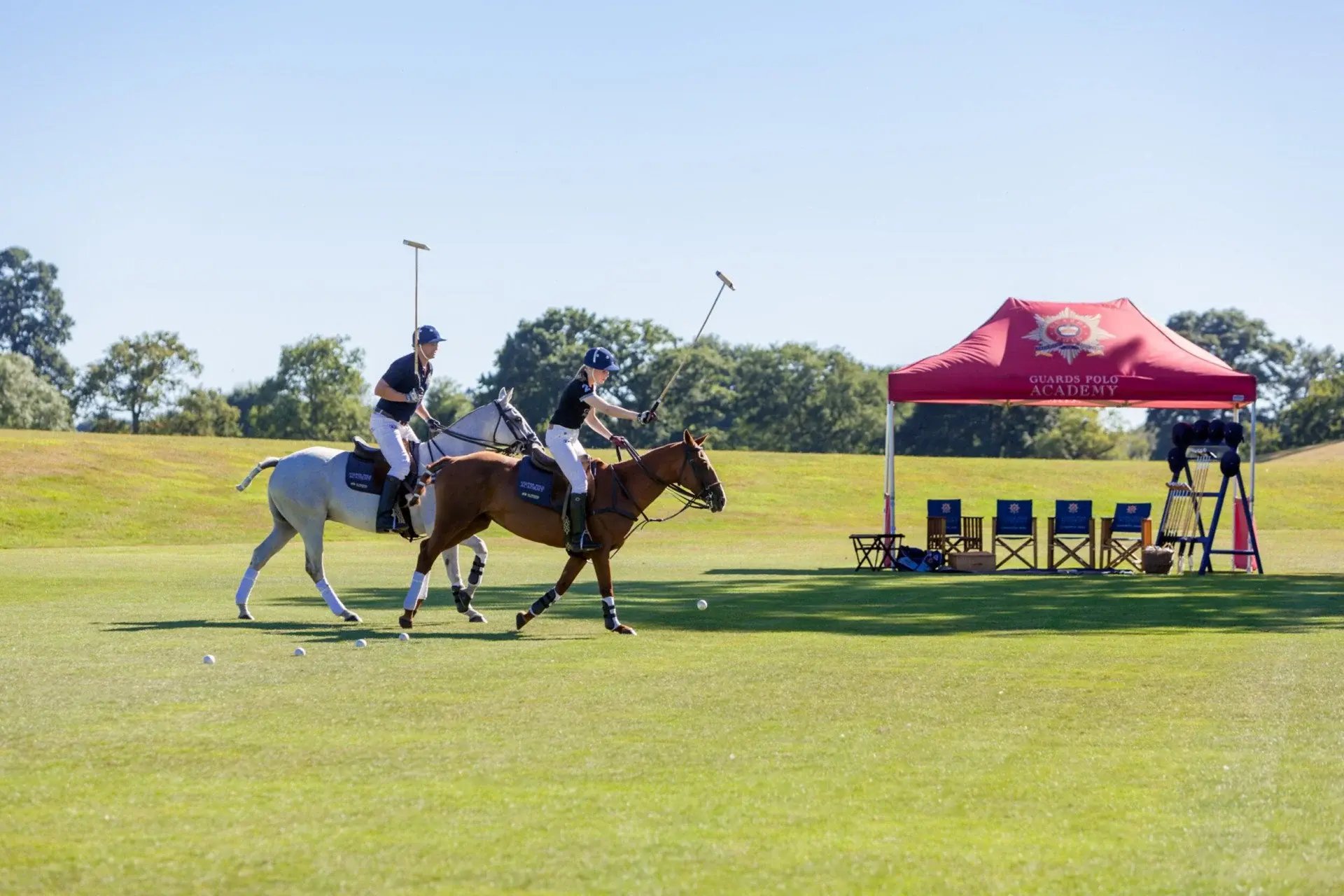 coworth-park-guards-polo-academy-lesson-hitting-balls-in-line-highres